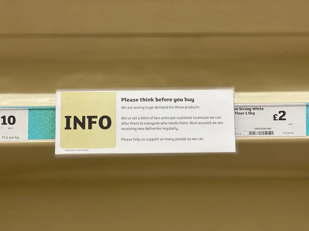 Person carefully examining nootropic supplement bottles on pharmacy shelf with thoughtful, evaluative expression while readin