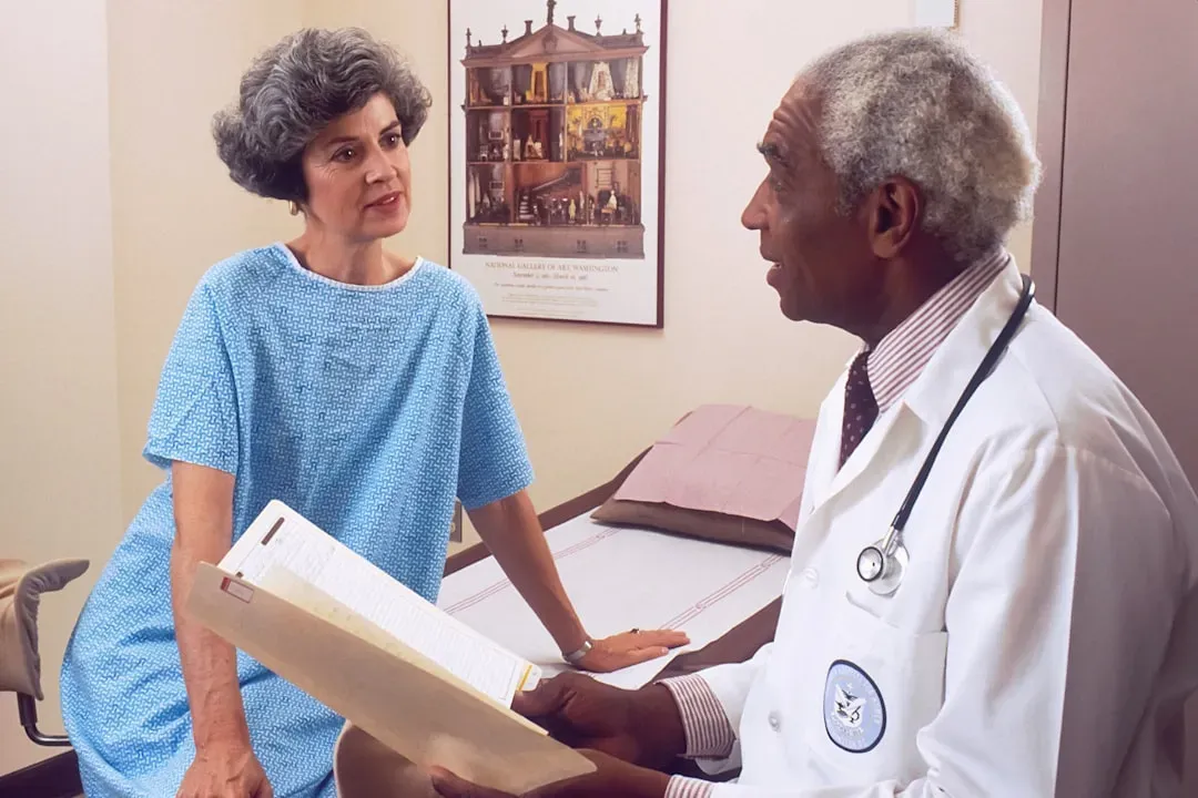 Older adult focused at desk in modern home office, demonstrating mental clarity and cognitive focus with Alpha GPC choline su