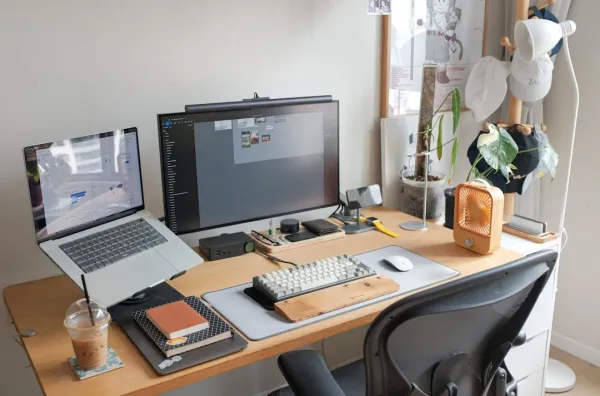 Mature professional focused at desk with supplements and water, demonstrating clean focus without stimulants for sustained co